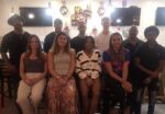 Olympians Crooks and Forbes give back to Cayman’s next generation Back left, Olympic athletes Ronald Forbes and Jordan Crooks, along with seven Cayman youth athletes and former Sports Minister Bernie Bush, back right, at special dinner. - Photo: Supplied