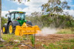 Crushing it: Beacon Farms machinery creates arable land for local farmers Beacon Farms' rock crusher at work. - Photo: Taneos Ramsay