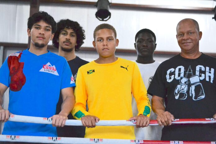 boxers From left, boxers Matthew Thompson, Isaiah Hurlston, Phillip Serrato Livingston Barnett, Demar Robinson and coach Philmore Barnett. – Photo: Seaford Russell Jr