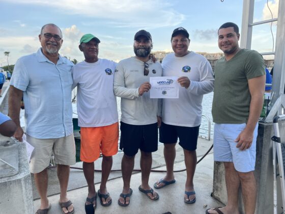 The crew of Key Card flanked by Joel Francis (l) and Joshua Ebanks (r)