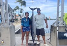 Fishing charter crew reel in $2,500 first prize with 63 lb wahoo Kat Watkinson and Julius Hubbell of Reelistik, winner of HoosWho Shoutout fishing competition. - Photo: Sarah Bridge