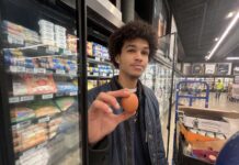 Egg prices hit record high as Cayman works to expand local supply Jamaul Barnes holds up an egg at the Foster's Supermarket at Camana Bay - Photo: Simon Boxall