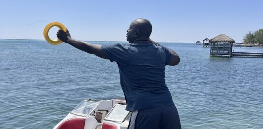 Alphonso Wright throws out a line, hoping to catch a fish. - Photo: Simon Boxall