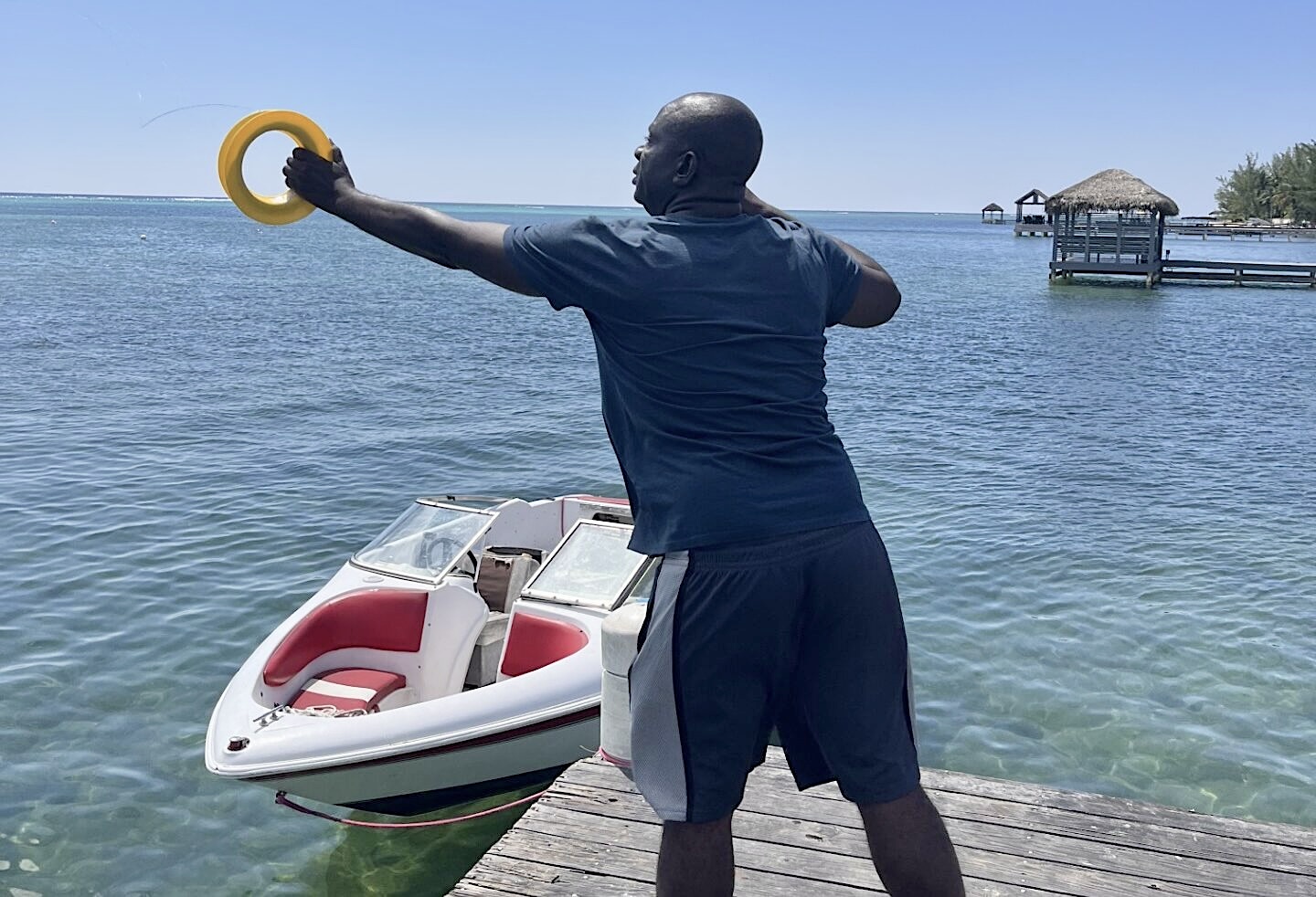 Fisherfolk-15 Alphonso Wright throws out a line, hoping to catch a fish. - Photo: Simon Boxall