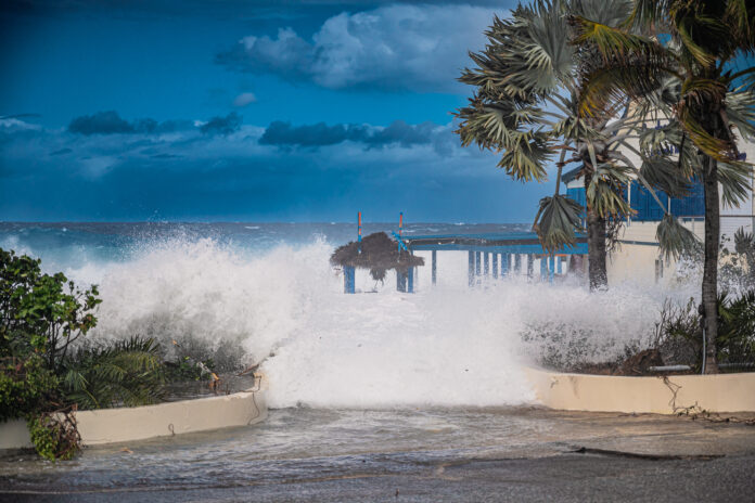 Rough Waves hit the shore in Grand Cayman. - Photo: by Taneos Ramsey