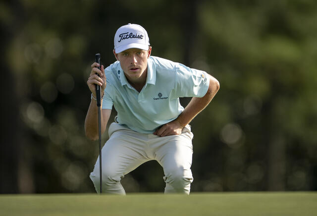 Justin Hastings lines up a putt on the 18th green at Augusta Thursday. - Photo: US Masters