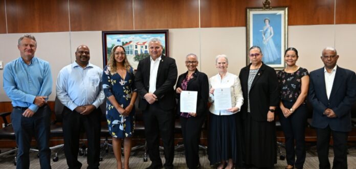 Cayman's domestic election observers have been formally appointed. From left, Marc Thomas, Christen Suckoo, Brittany MacVicar, Deputy Governor Franz Manderson, Deborah Ebanks, Governor Jane Owen, Nelva Ebanks, Jessica Anderson, and Abraham Mathew. - Photo: Supplied