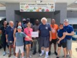 Pink Ladies distribute charitable donations Pink Ladies