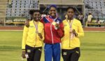 Kaliah Haye makes history at CARIFTA Games Kaliah Haye beams with joy while receiving her historic gold medal at the CARIFTA Games. - Photo: Submitted