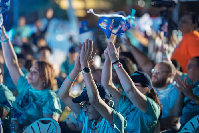 TCCP supporters show their appreciation at a rally Monday night. -Photo: Taneos Ramsay