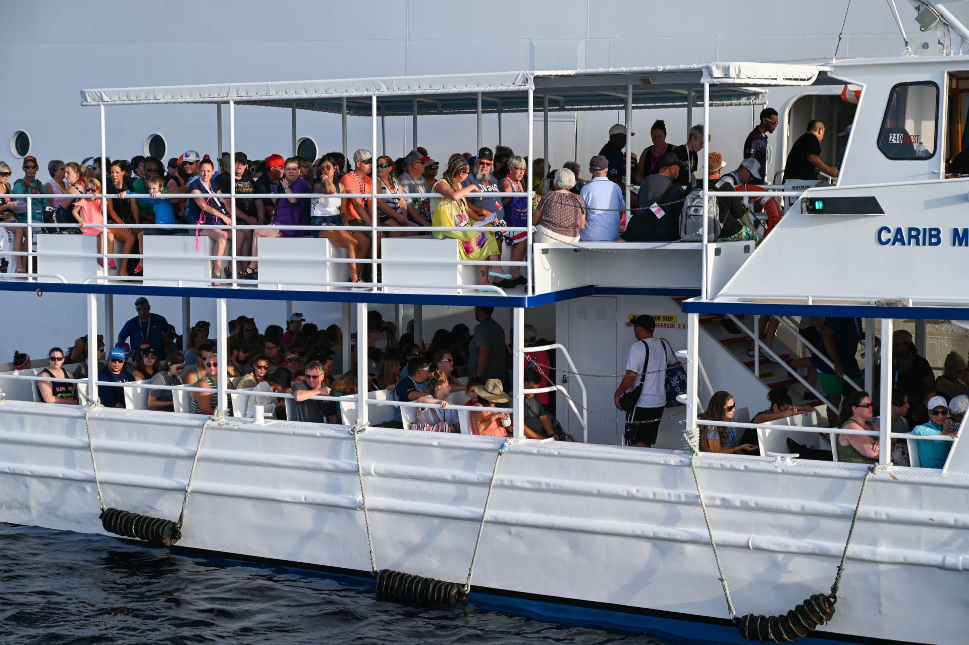 Cruise ship tourists ride a Caribbean Marine Services tender boat to shore. – Photos: Kayla Young and Alvaro Serey