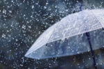 Dry conditions mark start of rainy season Transparent umbrella under heavy rain against water drops splash background. Rainy weather concept.