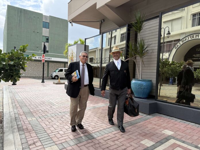 McKeeva Bush, left, and his lawyer Jerome Lynch, KC, leave court on Tuesday, following a hearing before the Court of Appeal. - Photo: Norma Connolly