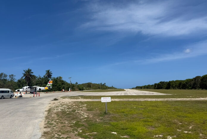 A Cayman Airways Twin Otter sits waiting for passengers at the apron of Little Cayman's Edward Bodden Airfield. A proposal to relocate the runway and terminal was discussed at a public meeting on the island on 29 May. - Photos: Norma Connolly