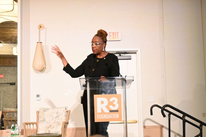 Laura Alleyne, of the Cayman Islands General Registry, speaks at an R3 Foundation conference about risks to charities. - Photo: Raymond Hainey