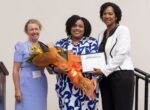 Young Caymanian earns excellence in nursing award Nurse Helen Kirk, left, poses with Nurse Shanique Ayres, this year's award winner, and Chief Nursing Officer Felicia McLean. - Photo: Submitted
