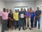 Coalition government forms with André Ebanks to be premier André Ebanks flanked by the three other elected members of The Caymanian Community Party, four from the Cayman Islands National Party, and independents Rolston Anglin, Isaac Rankine, and Jay Ebanks. - Photo: Submitted