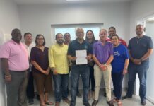 Coalition government forms with André Ebanks to be premier André Ebanks flanked by the three other elected members of The Caymanian Community Party, four from the Cayman Islands National Party, and independents Rolston Anglin, Isaac Rankine, and Jay Ebanks. - Photo: Submitted