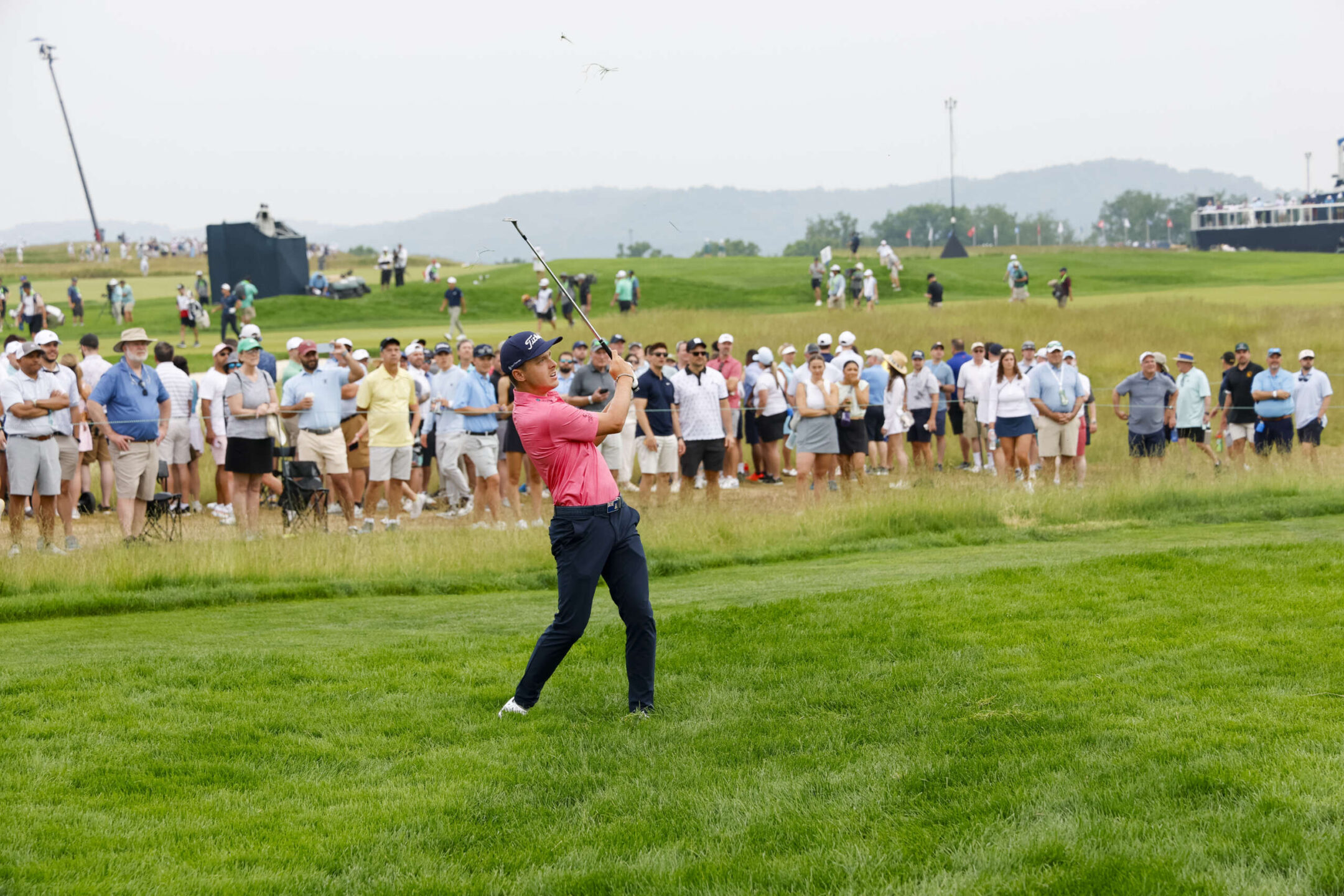 Justin Hastings plays a shot on the 11th hole with fans in the background during the second round of the 2025 US Open on Friday. - Photo: Jeff Haynes/USGA