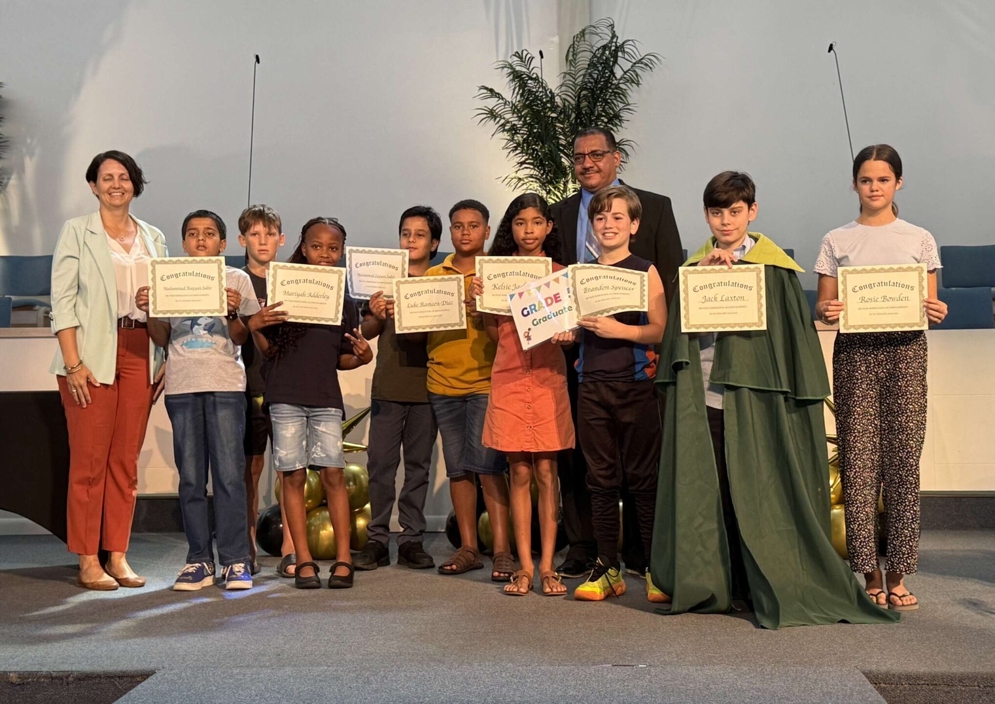 Grade 5 homeschoolers with Education Minister Rolston Anglin and Kimberly Kirkconnell from DES 