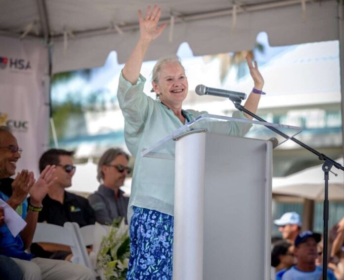 Governor Jane Owen addressing the crowd of swimmers and supporters at the race finish. - Photo: Shankar Ebanks