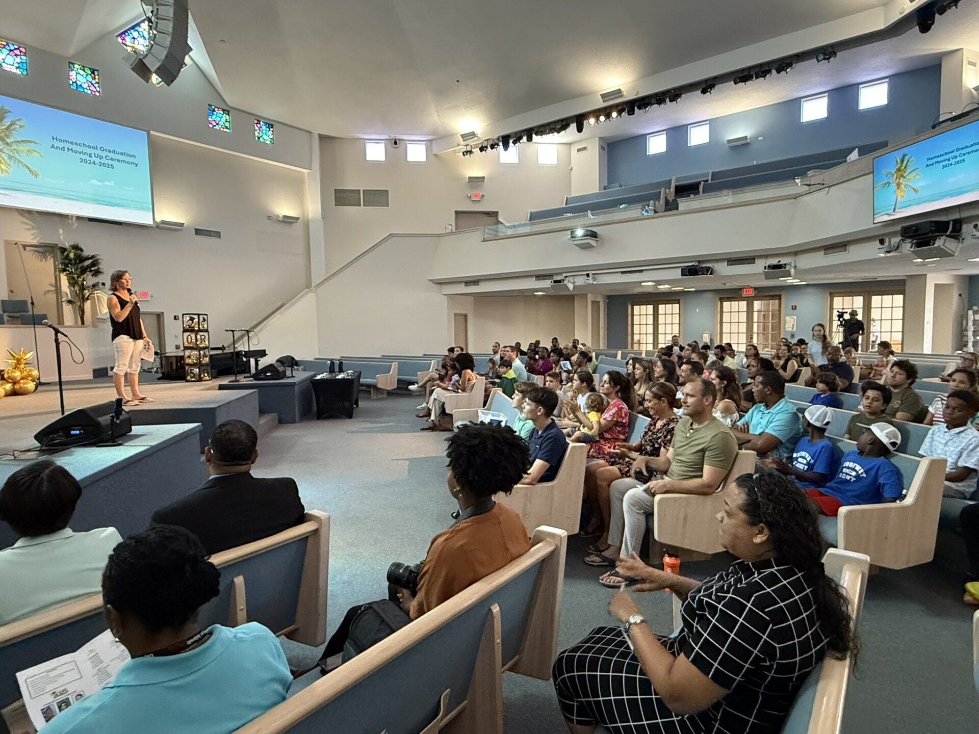 Homeschool Cayman's Kathleen Spencer addressing the students at last week's graduation
