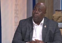 Immigration minister calls for 22-year wait for Caymanian status Minister Michael Myles, immigration reform, Caymanian status, Compass TV