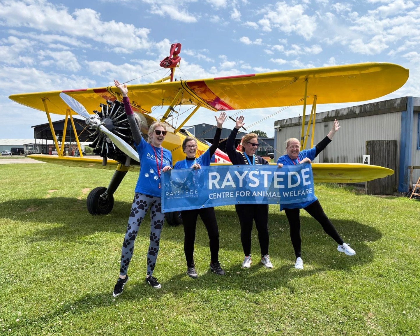 Sarah Hill (second from left) celebrating with fellow wing walkers after their flights