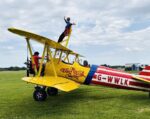 Humane Society co-founder, 82, fundraises with daring wing walk Sarah Hill getting securely strapped in before her daring wing walk
