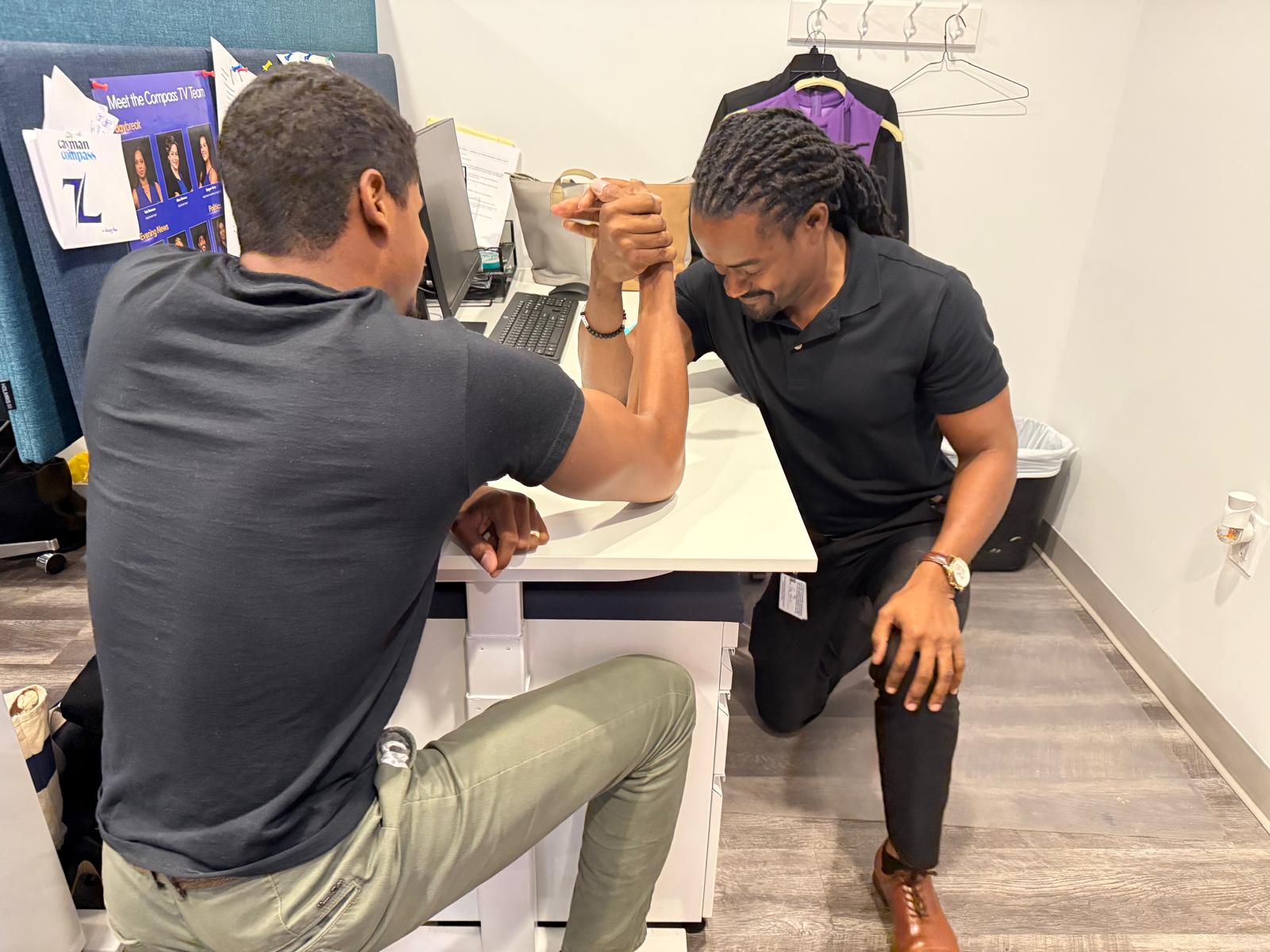 Andrel and Seaford Russell Jr. in a fiercely contested arm wrestle. - Photo: James Whitaker
