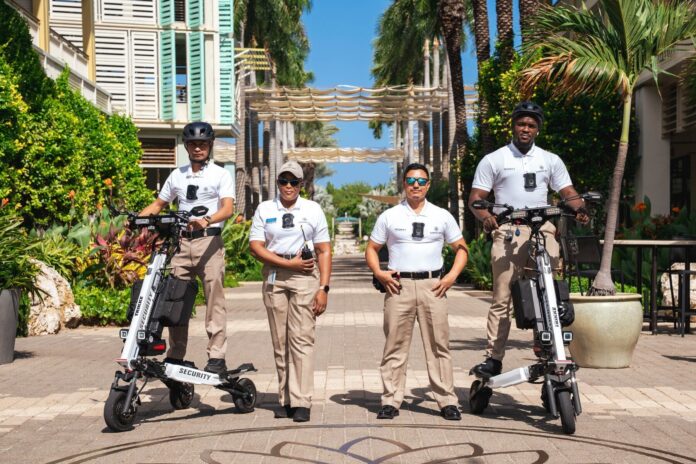 Members of the Camana Bay security team display their body-worn cameras. - Photo: Supplied