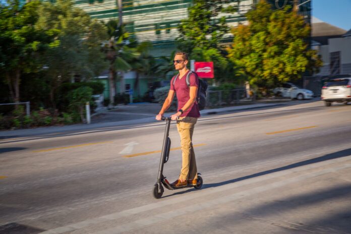 Electric scooters and e-bikes have become a common sight on Cayman's roads as an inexpensive way to travel around the island.