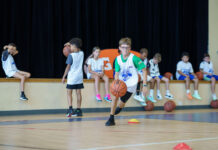 Camana Bay Basketball Camp under way with NBA player Jr. NBA Basketball camper cayman islands