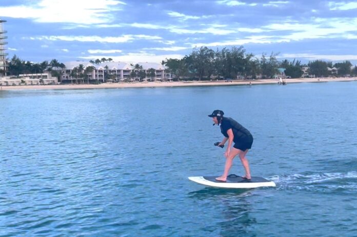 Sarah Bridge tries out eFoiling, Cayman's newest watersport