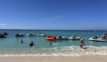 Coast Guard commandant calls for safer boating swimmers and jet skis on public beach