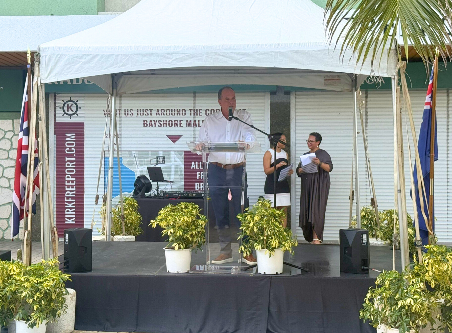 Deputy Premier Gary Rutty addresses the gathering celebrating 100 days of government in George Town on Friday. - Photo: Sarah Bridge