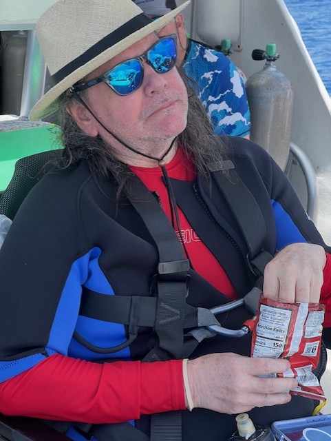 Blind scuba diver Bob Kitchens on the dive boat in Cayman Brac