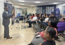 Female entrepreneurs get tips for business success at Chamber event Author and business mentor Linval Johnson address attendees at the Chamber of Commerce's Small Biz Bootcamp event