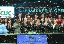 Cayman’s power firm marks 35 years on Toronto Stock Exchange CUC president and CEO Richard Hew (front, fourth from left) opens the Toronto Stock Exchange. -Photo: Supplied