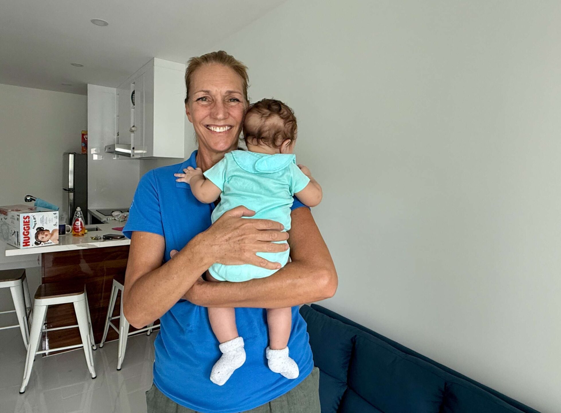 ARK's Tara Nielsen helps one of the charity's youngest clients settle into new housing. - Photo: James Whittaker