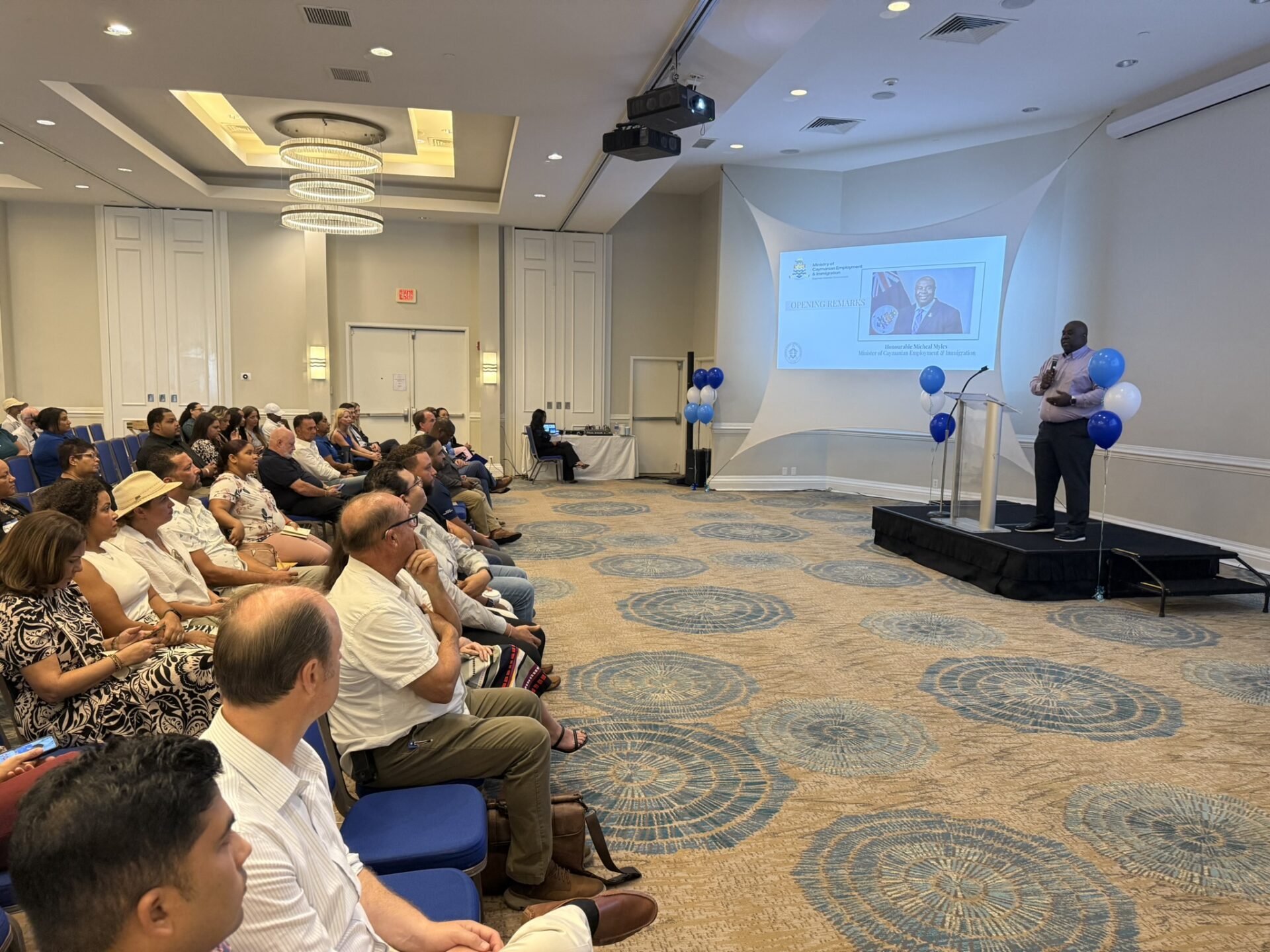 Caymanian Employment Minister Michael Myles speaks to the audience at the jobs fair. - Photo: Sarah Bridge