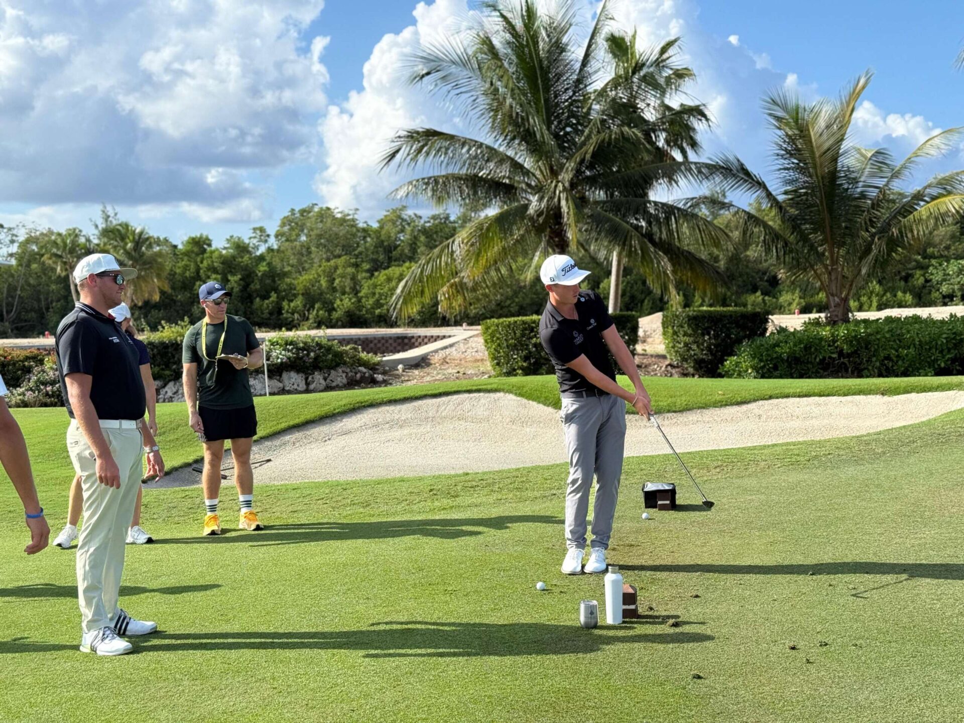 Golfing star Justin Hastings hitting a ball on the Ritz-Carlton golf course