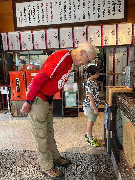 Bould praying at a shrine