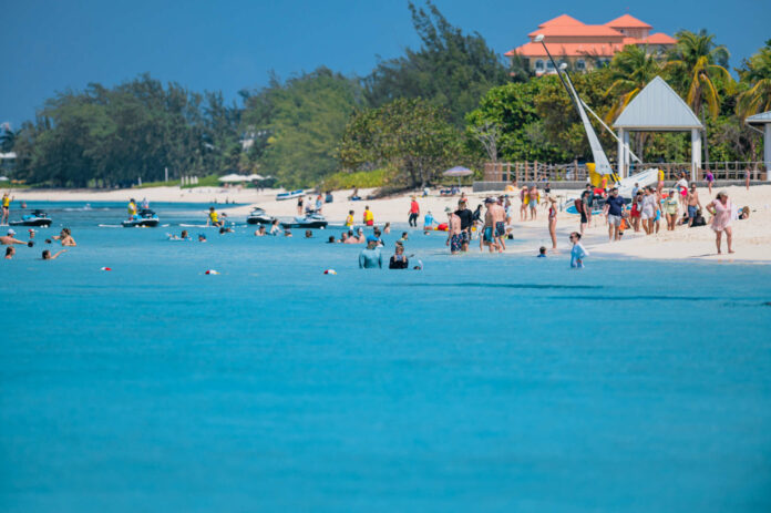 Tourists on Seven Mile Beach