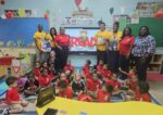 UCCI visits schools to promote reading on International Literacy Day UCCI representatives along with students and faculty of Sir John A Cumber Primary School during their visit to the school to promote International Literacy Day on 8 Sept. - Photo: Supplied