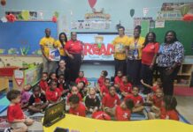 UCCI visits schools to promote reading on International Literacy Day UCCI representatives along with students and faculty of Sir John A Cumber Primary School during their visit to the school to promote International Literacy Day on 8 Sept. - Photo: Supplied