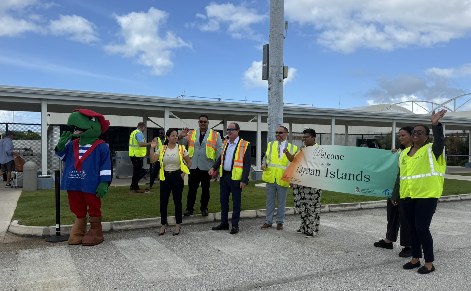 Ministers Jay Ebanks and Gary Rutty and others greeting arrivals from the JetBlue flight from Fort Lauderdale