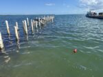 Repairs begin for public dock destroyed in a storm in 2021