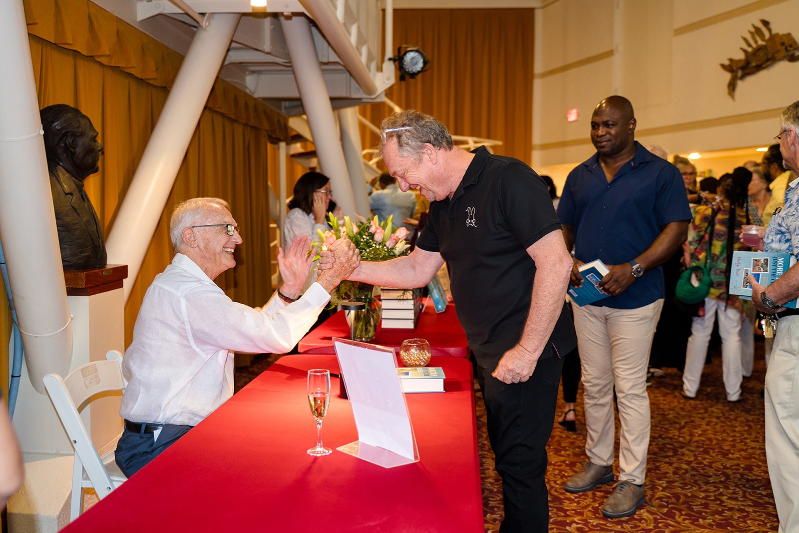 Martyn Bould signing copies of 'More Than Just The Climb' at his book launch.