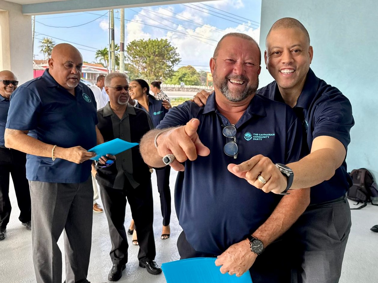 TCCP leader André Ebanks, right, with Robert Bodden and his team in Bodden Town on Nomination Day
